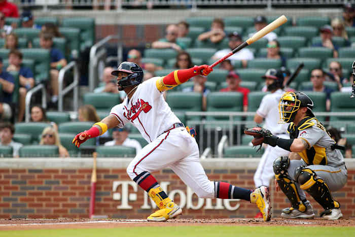 Jun 11, 2022; Atlanta, Georgia, USA; Atlanta Braves right fielder Ronald Acuna Jr. (13) hits a home run against the Pittsburgh Pirates in the first inning at Truist Park.